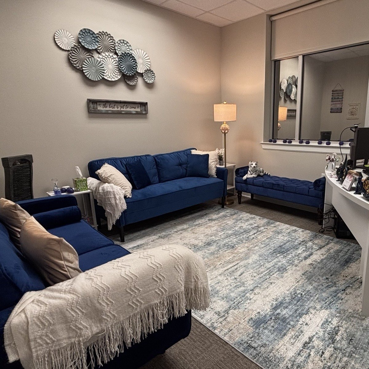 The Blue Room, with sofas around a patterned rug
