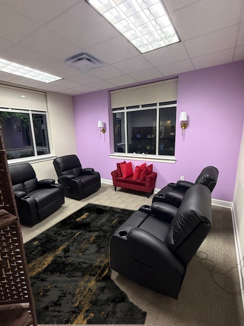 The Relaxation Room from the window end, with the red loveseat